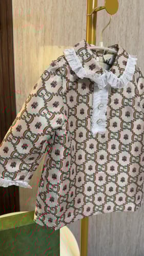 فستان قوتشي بأكمام طويله