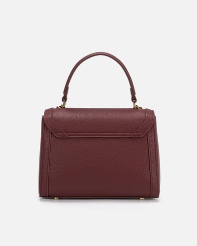 شنطة نسائية أنيقة باللون العودي