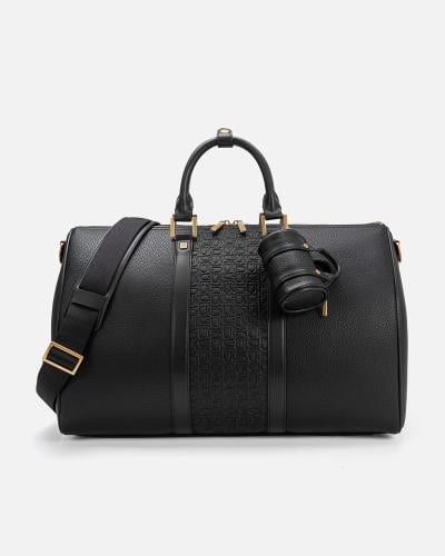 شنطة من الجلد الفاخر بلون أسود