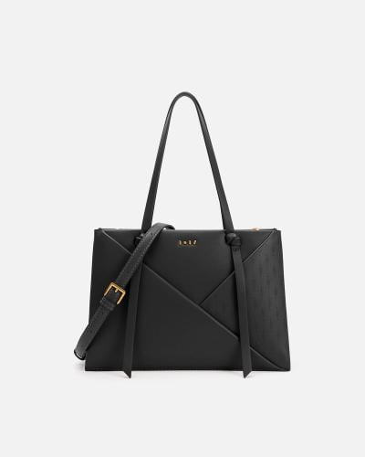 شنطة نسائية من الجلد باللون الأسود