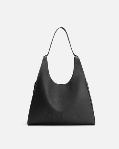 شنطة نسائية من الجلد بلون أسود