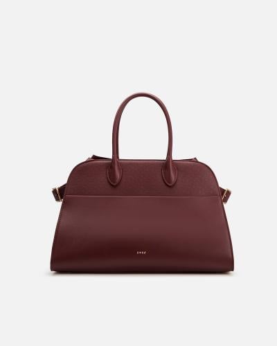 شنطة نسائية أنيقة باللون العودي