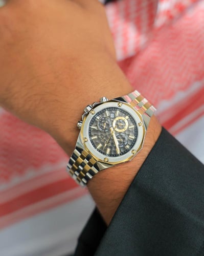 ساعة سعد الرجالية من الستيل بلون فضي وذهبي
