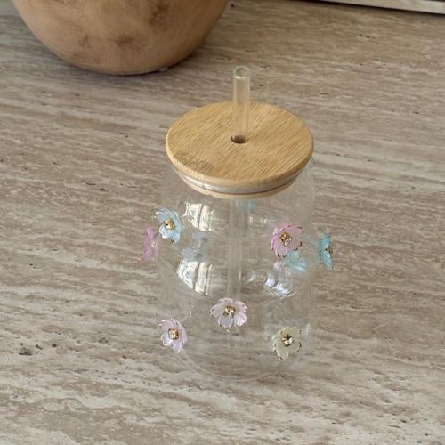 Glass cup with straw and lid