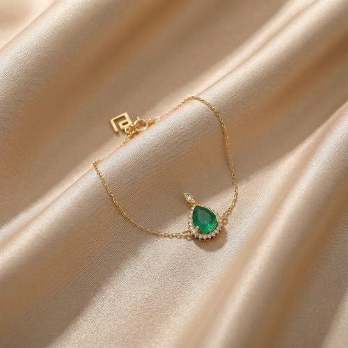 اسواره ذهب مرصع بالالماس و حجر زمرد