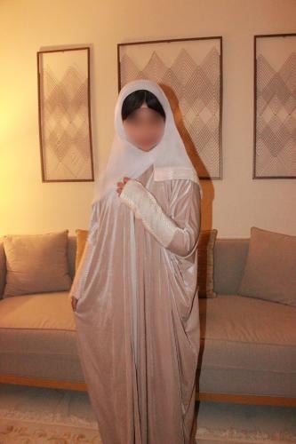 Beige velvet abaya with wool sleeves and thumb holes, paired with a matching dress.
