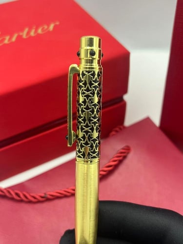 قلم كارتير سانتوس ذهبي على اسود