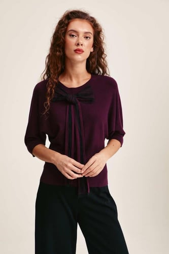 بلوزة محبوكة بفيونكة تول