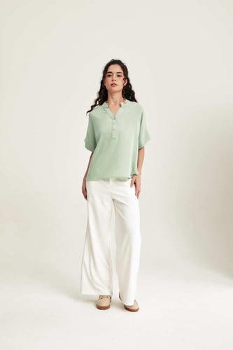 بلوزة فضفاضة بأكمام قصيرة