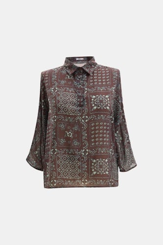 بلوزة فضفاضة مزينة بنقوش