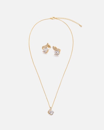 ‎ طقم نسائي بتصميم أنيق بلون ذهبي