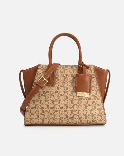 شنطة نسائية من الجلد باللون البني