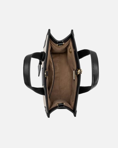 شنطة نسائية مميزة باللون البيج والأسود