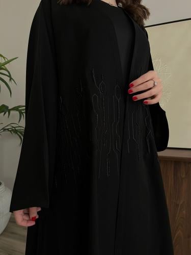 Korean crepe with black embroidery and black face from the front and back with a distinctive flared story