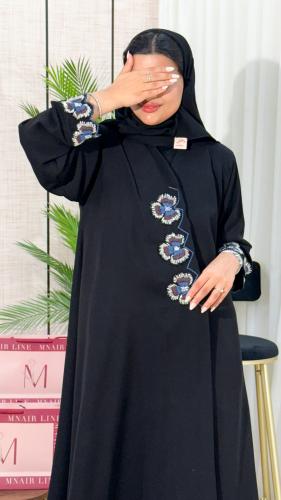 M27 Abaya with wide flare, embroidered, and decorated on the sleeves and from the front.