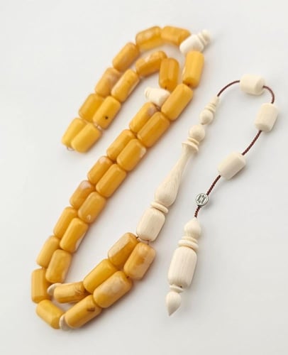 سبحه كهرمان بعاج برميلي 33 خرزه