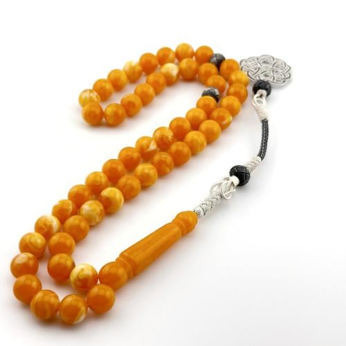 سبحه من البكلايت باللون البرتقالي بتعريقه بيضاء بت...