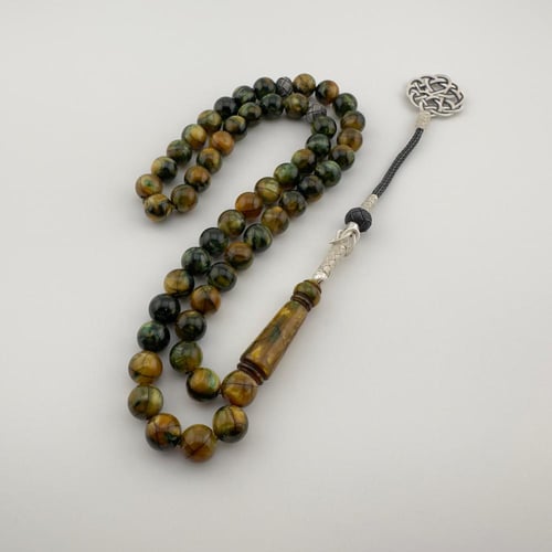 سبحه من البكلايت باللون العشبي بتموج صدفي لامع بتف...