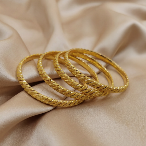 A ring with a poured, polished, and matte finish,...