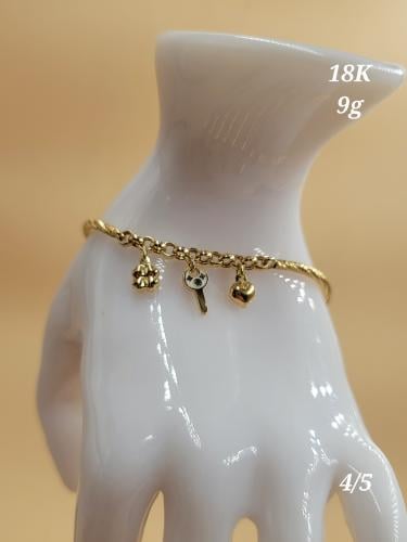 Gold bracelet with dangling key and heart, 18 kara...