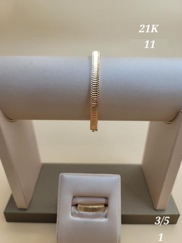 A modern bracelet and ring set, made of pure gold...