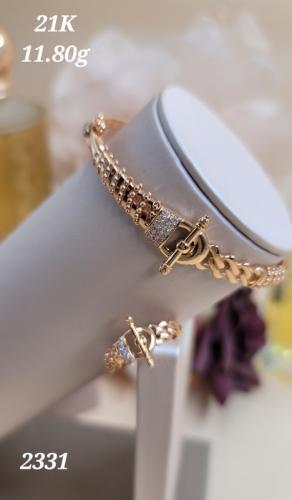 A bracelet and ring set in gold with an anchor design - 21 karat