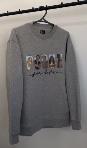 سويتر outer banks