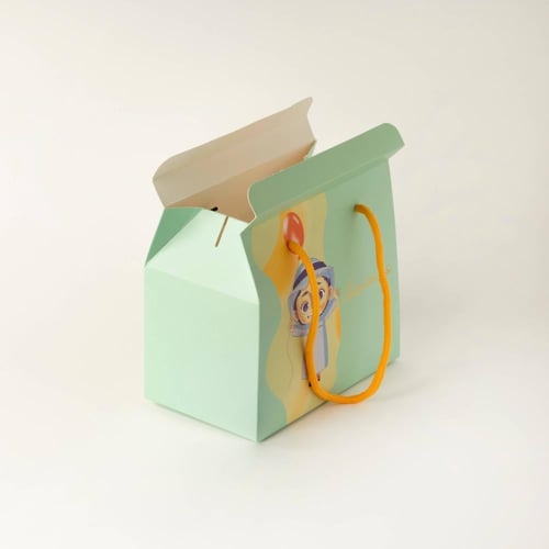 علب التوزيعات للأولاد بلون أخضر وعبارة "عيدكم مبار...