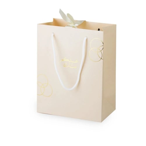 أكياس فاخرة للعيد لون بيج بدوائر ذهبية وختم "عيدكم...