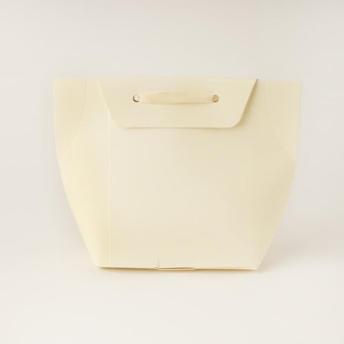 حقيبة توزيعات ورقية فاخرة بلون بيج وعبارة"عيدكم مب...