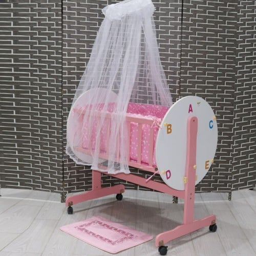 سرير أطفال حديثي الولادة مصنوع من الخشب ومزود بعجل...