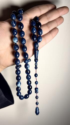 Blue wavy bead, hand-engraved, size of the bead: 13 mm by 10, story: dove egg, number of beads: 41