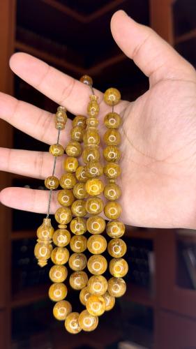 Two wooden brown bracelets with Tamlika, bead size...