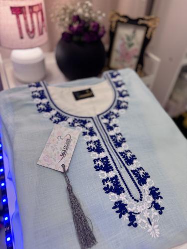 Elegant embroidery on luxurious linen fabric, with soft silky threads decorating the chest and sleeves, to give you a sophisticate...