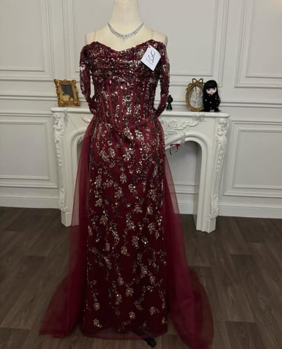 فستان بتول العنابي