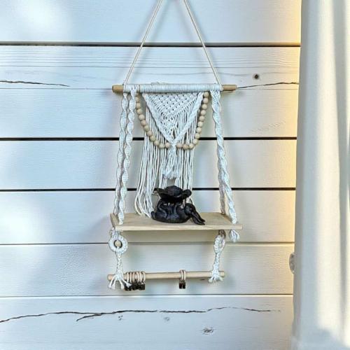 Wall shelf made of wood and macrame with a hanging...