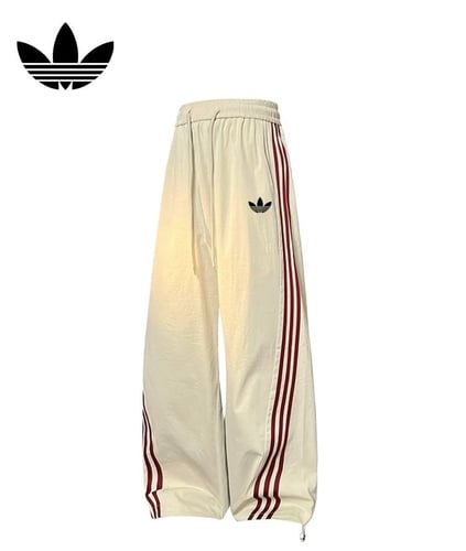 سروال adidas بقصة واسعة