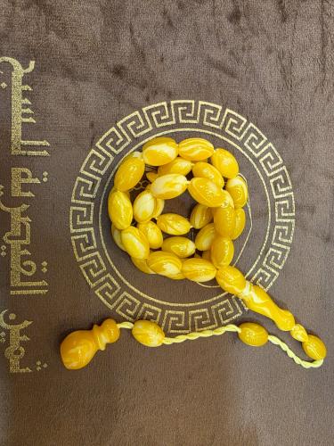 Amber-colored clay prayer beads