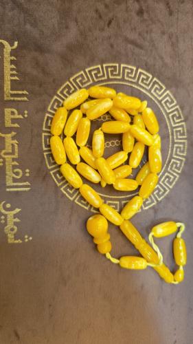 Amber-colored clay prayer beads