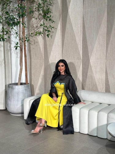 فستان اصفر مع قطعه اسود