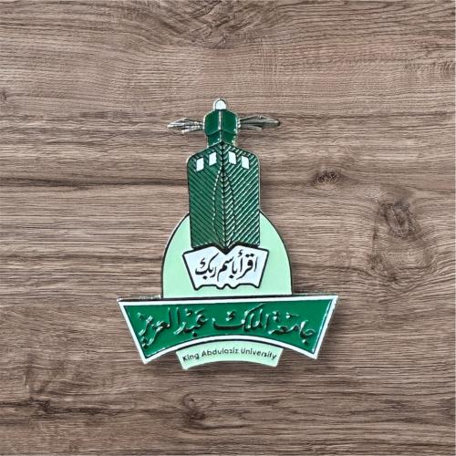 بروش معدني بشعار جامعة الملك عبدالعزيز