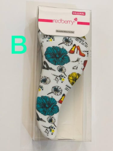 فرشاة فك التشابك