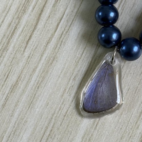 ميدالية جناح فراشة