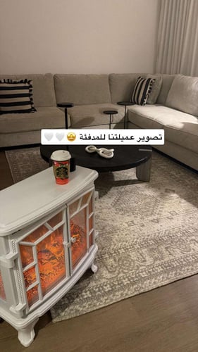 دفاية ديكور على شكل دولاب مع ريموت لون ابيض