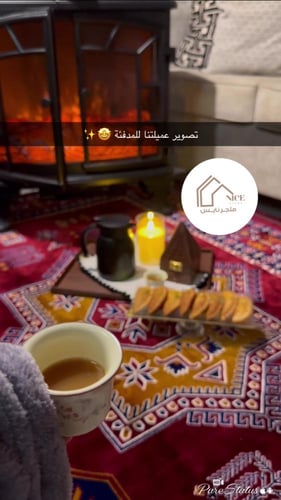 دفاية ديكور على شكل دولاب مع ريموت لون أسود