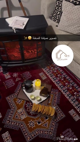 دفاية ديكور على شكل دولاب مع ريموت لون أسود