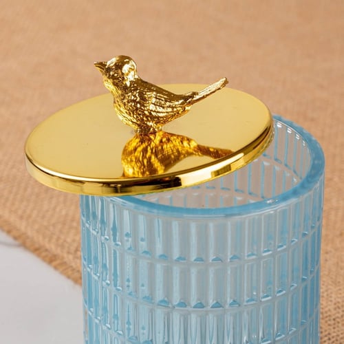 علبة زجاج بغطاء ذهبي
