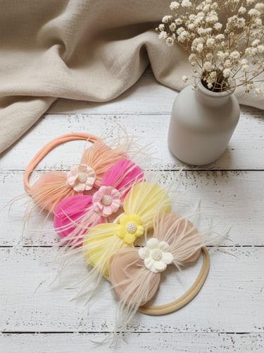 ربطة بيبي قماشية بالريش