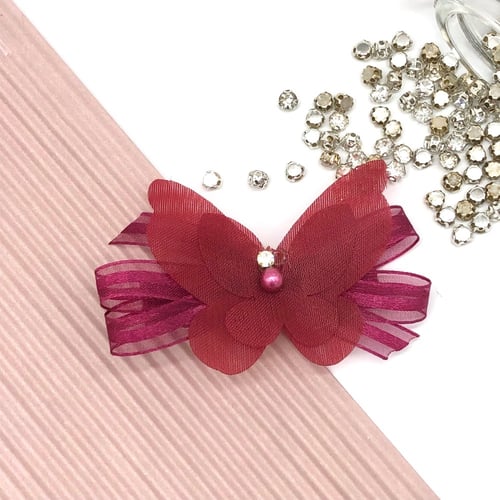 بنسة بشكل فراشة بألوان متعددة