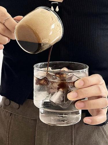 A glass cup for Americano with a simple design